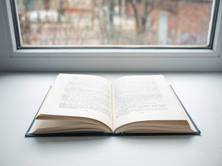 One blue beautiful open book on white isolate background. beautiful blue book cover