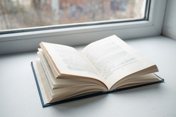 One blue beautiful open book on white isolate background. beautiful blue book cover