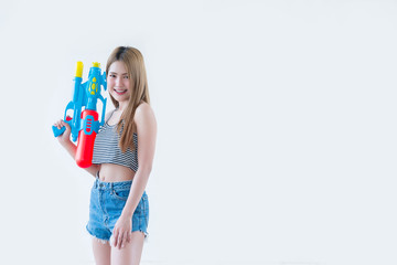 Asian sexy woman with gun water in hand on white background,Festival songkran day at thailand,The best of festival of thai,Land of  smile