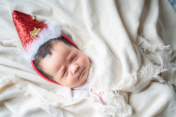 Sleeping of christmas infant baby santa hat decoration