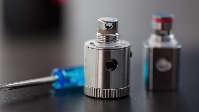 Repair,maintenance vaping device mod.Upgrade parts for modern vaporizer e-cig device,spare parts.Micro coil clearomizer.Quit smoking nicotine cigarette,start vaping safe ecig vape