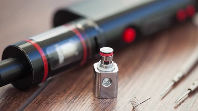 Repair,maintenance vaping device mod.Upgrade parts for modern vaporizer e-cig device,spare parts.Micro coil clearomizer.Quit smoking nicotine cigarette,start vaping safe ecig vape