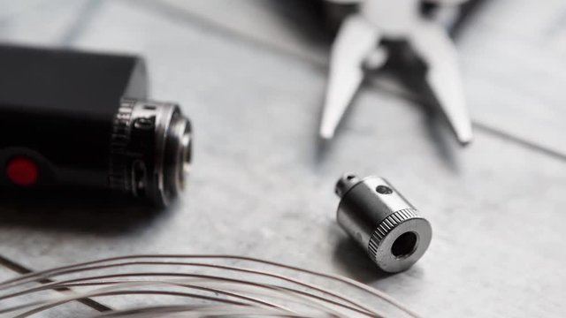 Repair,maintenance vaping device mod.Upgrade parts for modern vaporizer e-cig device,spare parts.Micro coil clearomizer.Quit smoking nicotine cigarette,start vaping safe ecig vape