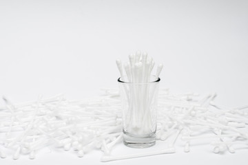 Cotton swab in the glass with white paper background