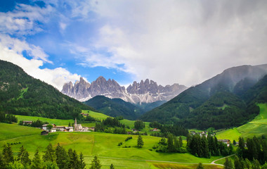 Fototapeta na wymiar Alpine landscape with Santa Maddalena Alta and The Dolomites Mountains
