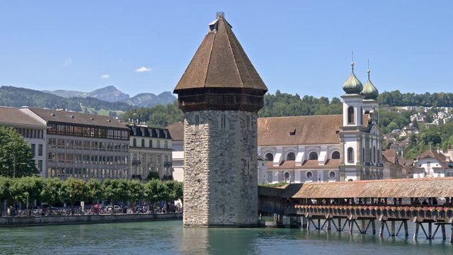 The famous Wasserturm tower and the Jesuit Church in Lucerne.