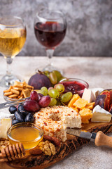 Cheese plate with grapes and wine