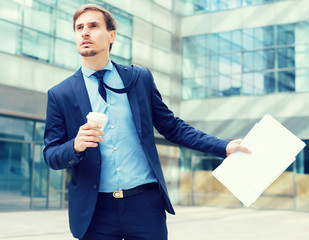 Portrait of busy man in suit rushing