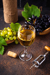 Grape, wine and vintage corkscrew