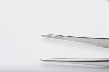 debakey forceps on the white surface