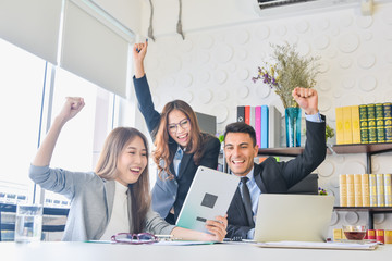 Cheering happy business people ,Happy business team with arm raised sitting in office during an office monthly meeting success, business concept background ,Activity moving blurred concept