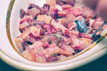 Sliced fish meat for salad. Finely chopped fish