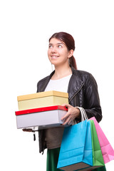 Fototapeta premium Happy young woman with shopping bags and boxes