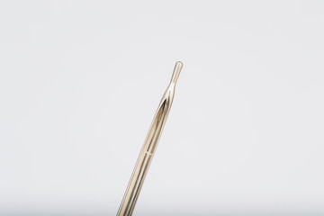 Buttoned probe for fistula on white background