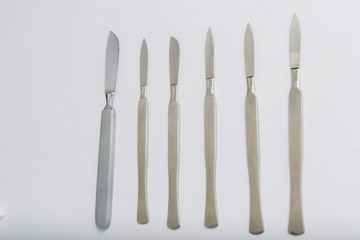 Different One-Piece Scalpels on white background