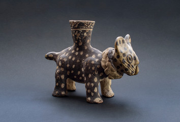 Pre-columbian feline pottery called "Huaco" from Chancay, an ancient Peruvian culture. Pre inca handcrafted pottery piece made by this ancient civilization.
