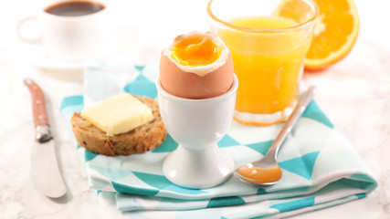 full breakfast with orange juice, egg and coffee cup