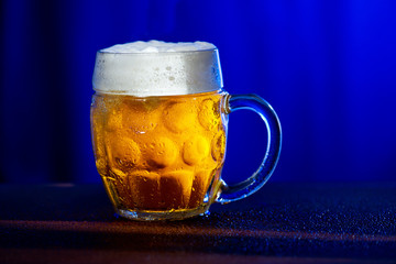 Glass of beer isolated on the white background