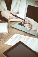 Business woman giving pen to businessman ready to sign contract. Success communication at meeting or negotiation