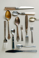 Vintage cutlery on grey background.