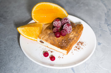 orange and berry pie on a plate