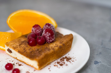 orange and berry pie on a plate