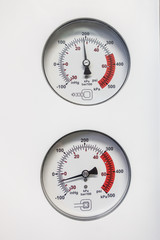 two barometers indicate the pressure