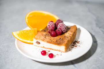 orange and berry pie on a plate