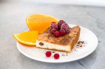 orange and berry pie on a plate