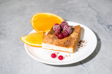 orange and berry pie on a plate