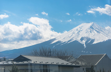 View from train window with Mount Fuji on blue sky background.Fujisan,Railway Journey
