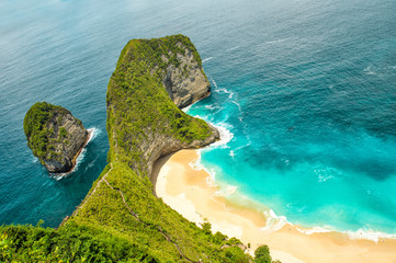 Sea rocks sand beach turquoise ocean Nusa Penida Island Bali
