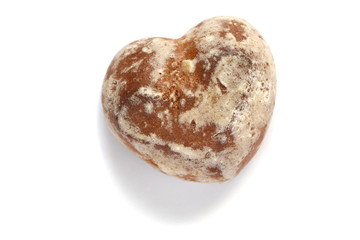  gingerbread in the shape of a heart with shadow on an isolated white background