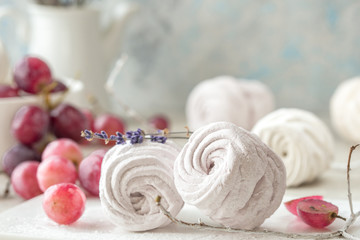 Homemade zephyr and mint on an old wooden table covered 