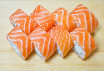 Rainbow Sushi Roll with salmon, eel, tuna, avocado, royal prawn, cream cheese Philadelphia, caviar tobica, chuka. Sushi menu. Japanese food.