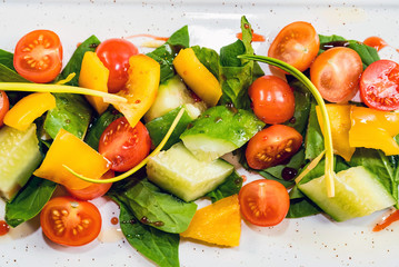 Delicious healthy vegetable salad on white plate