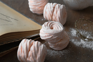 Homemade zephyr and mint on an old wooden table covered 