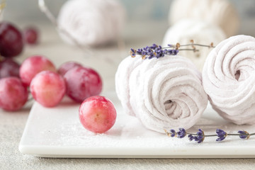 Homemade zephyr and mint on an old wooden table covered 