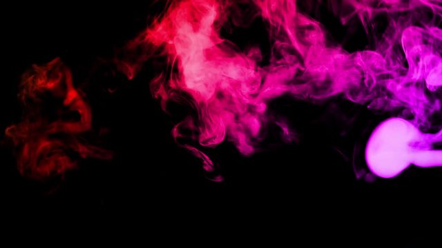 Spread of real colored gas on black screen background