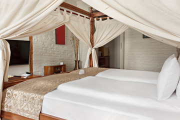 Luxurious modern bedroom interior with canopy bed