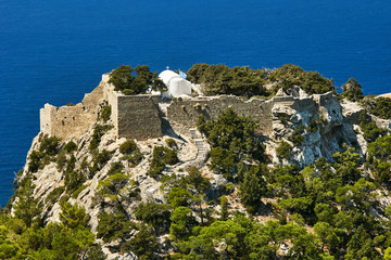 Hill with the ruins of the medieval castle of the Order of the Knights .on the island of Rhodes.