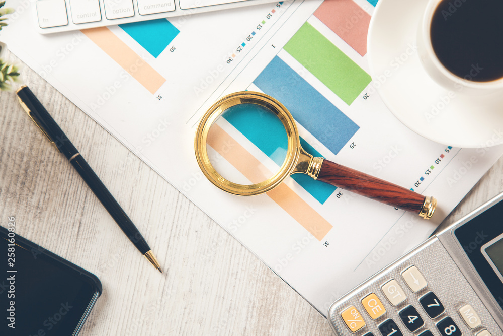 Poster magnifier on graph on working desk