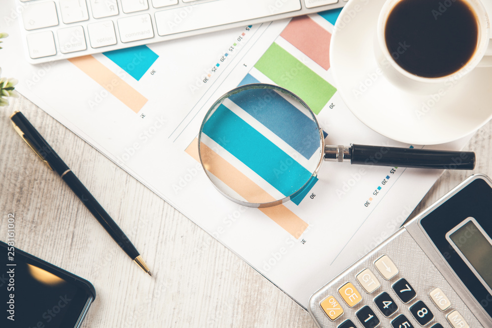 Poster magnifier on graph on working desk