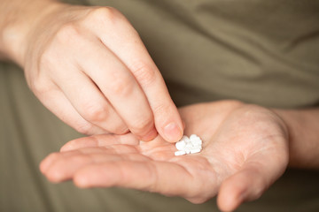Colorful pills and medicines in the hand 