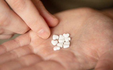 Colorful pills and medicines in the hand 