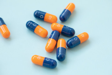 medical pills on blue background. Healthcare concept.