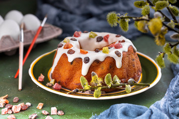Easter cake with raisins and candied fruits on a platter