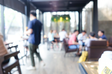 Blurred people working and recreation in modern cafe