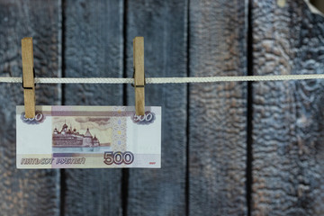 Bills hanging on a rope