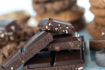 Various shortbread, oat cookies, chocolate chip biscuit and pieces of chocolate with seeds and nuts.
